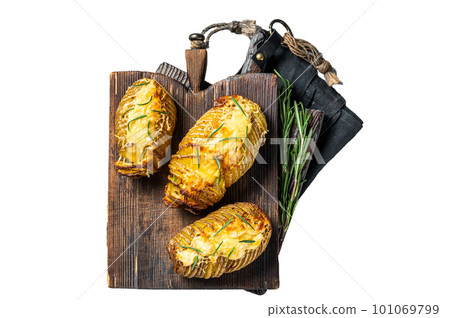 Roasted hasselback potatoes with cheese, garlic, thyme and rosemary. Isolated on white background. Roasted hasselback potatoes with cheese, garlic, thyme and rosemary. Isolated on white background. 101069799