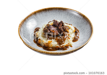 Slow cooked beef cheeks in red wine sauce with mashed potato. Isolated on white background Slow cooked beef cheeks in red wine sauce with mashed potato. Isolated on white background 101070163