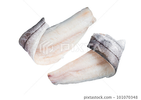 Two raw haddock fish fillets on kitchen table. Isolated on white background Two raw haddock fish fillets on kitchen table. Isolated on white background 101070348