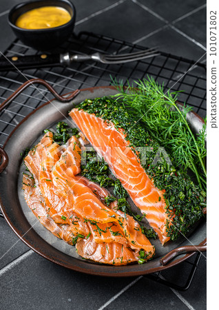 Pickled Salmon fillet with dill, salt and papper, gravlax. Black background. Top view 101071802