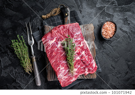 Piece of raw beef brisket, bbq smoker meat. Black background. Top view Piece of raw beef brisket, bbq smoker meat. Black background. Top view 101071942