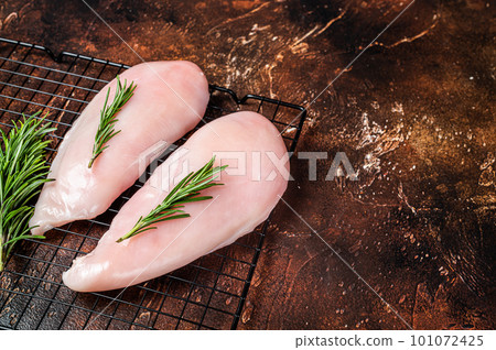 Fresh Raw chicken breast fillet, fowl meat. Dark background. Top view. Copy space Fresh Raw chicken breast fillet, fowl meat. Dark background. Top view. Copy space 101072425