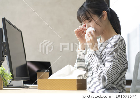 A young woman suffering from hay fever A young woman suffering from hay fever 101073574
