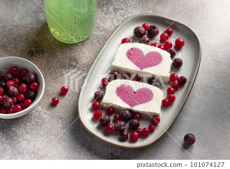 vanilla ice cream with berry heart filling 101074127