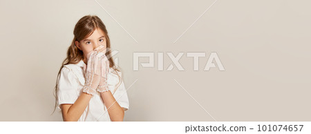 Banner of little charming girl wearing white gloves and closed mouth over light background 101074657
