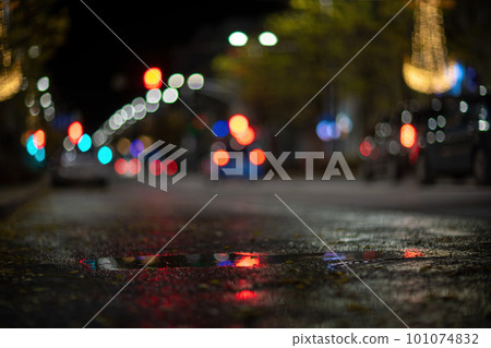 Blurred footage of transport. Blur of city lights along the road, light out of focus at night. Night city traffic, beautiful background. Blurred footage of transport. Blur of city lights along the road, light out of focus at night. Night city traffic, beautiful background. 101074832
