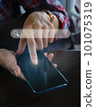 hand holding a smartphone to use the search bar find information data and more on the internet 101075319
