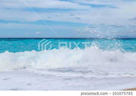Azure breaker waves on beach, island in Greece Azure breaker waves on beach, island in Greece 101075785