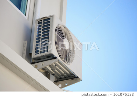 Air condition outdoor unit compressor install outside the house with blue sky Air condition outdoor unit compressor install outside the house with blue sky 101076158