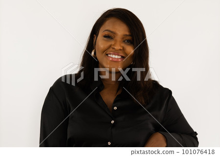 Young african american woman wearing dress posing over white wall at home - inclusion and diversity concept Young african american woman wearing dress posing over white wall at home - inclusion and diversity concept 101076418