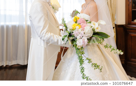 Bride and groom holding a bouquet Wedding ceremony 101076647