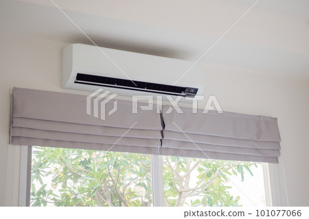 Air conditioner on white wall room interior background Air conditioner on white wall room interior background 101077066