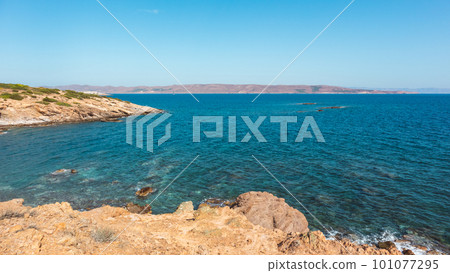 Rocky cliffs, blue sea shore landscape, Greece Rocky cliffs, blue sea shore landscape, Greece 101077295