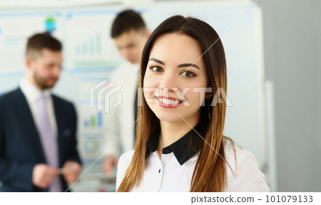 Portrait of smiling businesswoman in the background business partners Portrait of smiling businesswoman in the background business partners 101079133