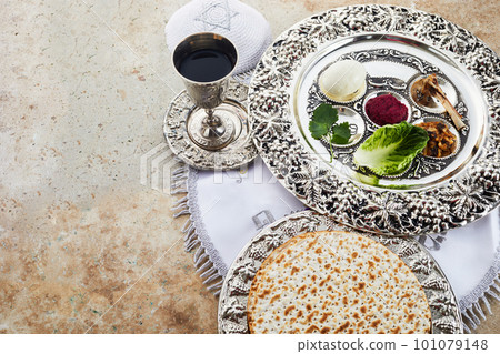 Composition with symbolic Passover, Pesach, items and meal on stone background, 101079148