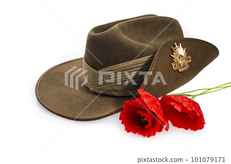 Anzac Day army slouch hat with red poppy isolated on white background. Anzac Day army slouch hat with red poppy isolated on white background. 101079171