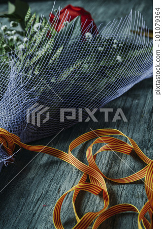 bouquet with a red rose for Saint George Day 101079364