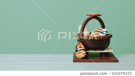 chocolate basket with eggs, banner format 101079372