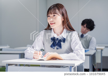Teenagers in uniforms taking preparatory school classes Teenagers in uniforms taking preparatory school classes 101079845