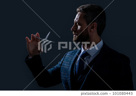 hairsdresser man hold scissors isolated on grey background. hairsdresser man with scissors hairsdresser man hold scissors isolated on grey background. hairsdresser man with scissors 101080443