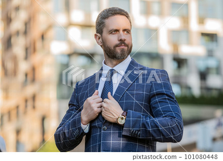 handsome business employee on urban background. business employee handsome business employee on urban background. business employee 101080448
