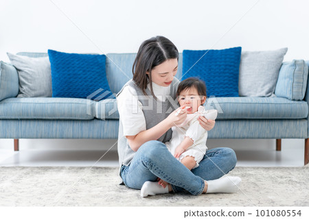 Baby eating baby food Baby eating baby food 101080554