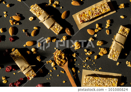 Homemade Granola energy bar. Variety of homemade protein granola breakfast bars ingredients nuts, raisins dried cherries and chocolate. Healthy nutrition eating Gluten free cereal dieting snack super Homemade Granola energy bar. Variety of homemade protein granola breakfast bars ingredients nuts, raisins dried cherries and chocolate. Healthy nutrition eating Gluten free cereal dieting snack super 101080824