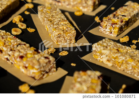 Homemade Granola energy bar. Variety of homemade protein granola breakfast bars, with nuts, raisins dried cherries and chocolate. Healthy nutrition eating Gluten free cereal dieting snack super food Homemade Granola energy bar. Variety of homemade protein granola breakfast bars, with nuts, raisins dried cherries and chocolate. Healthy nutrition eating Gluten free cereal dieting snack super food 101080871