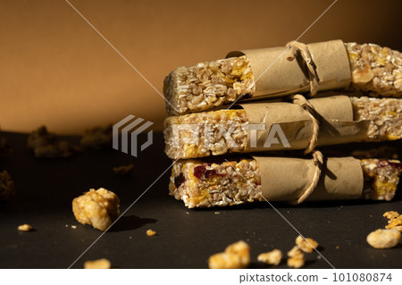 Homemade Granola energy bar. Variety of homemade protein granola breakfast bars with nuts, raisins dried cherries and chocolate. Healthy nutrition eating Gluten free cereal dieting snack super food Homemade Granola energy bar. Variety of homemade protein granola breakfast bars with nuts, raisins dried cherries and chocolate. Healthy nutrition eating Gluten free cereal dieting snack super food 101080874