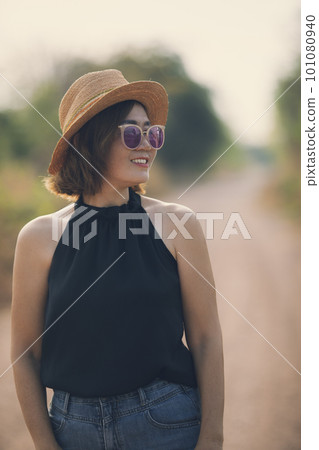 beautiful asian woman wearing straw hat standing outdoor with toothy smiling face beautiful asian woman wearing straw hat standing outdoor with toothy smiling face 101080940