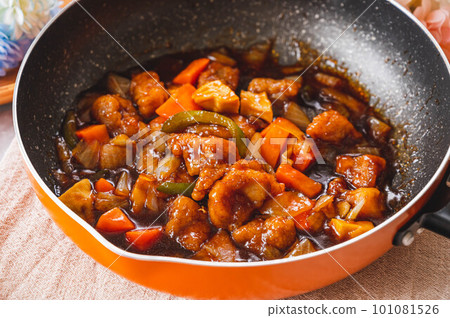 Sweet and sour pork made in a frying pan Sweet and sour pork made in a frying pan 101081526