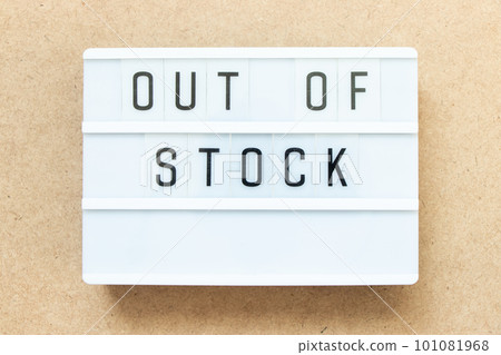 Lightbox with word out of stock on wood background 101081968