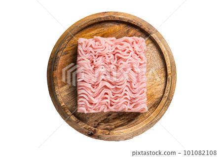 Raw mince or ground chicken meat on wooden board. Isolated on white background. 101082108