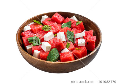 Watermelon Salad with feta cheese in a wooden plate. Isolated on white background. Watermelon Salad with feta cheese in a wooden plate. Isolated on white background. 101082170