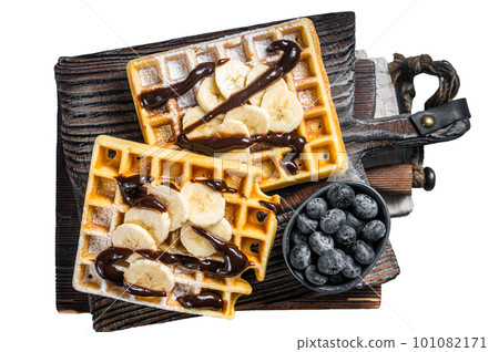 Traditional belgian waffles with fresh banana and Chocolate sauce . Isolated on white background. 101082171