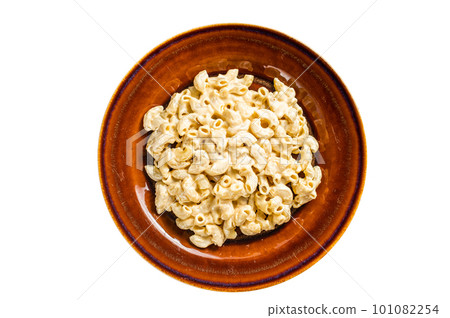 Macaroni Mac and cheese with Cheddar sauce in a plate. Isolated on white background. Macaroni Mac and cheese with Cheddar sauce in a plate. Isolated on white background. 101082254