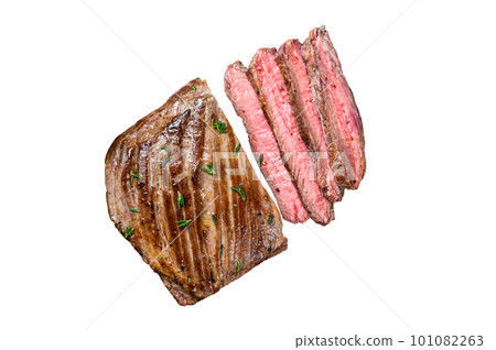 Sliced flank or bavette beef meat steak on a cleaver. Isolated on white background Sliced flank or bavette beef meat steak on a cleaver. Isolated on white background 101082263