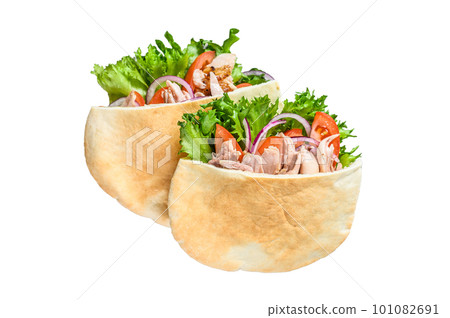 Doner kebab with grilled chicken meat and vegetables in pita bread. Isolated on white background. Doner kebab with grilled chicken meat and vegetables in pita bread. Isolated on white background. 101082691