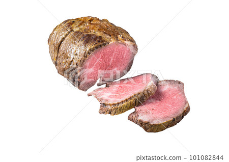 Roast beef meat fillet on kitchen table. Isolated on white background. Roast beef meat fillet on kitchen table. Isolated on white background. 101082844