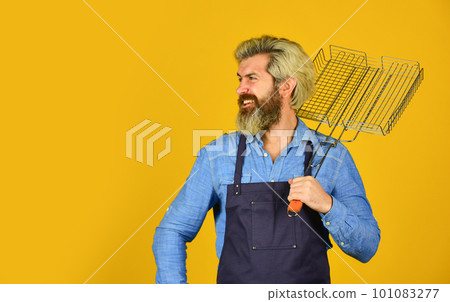 Tools for roasting meat outdoors. Picnic and barbecue. ready for barbecue party. Culinary concept. summer weekend. happy hipster hold cooking utensils for barbecue. bearded man chef. copy space 101083277