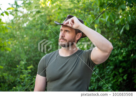 unshaven man wearing western hat. caucasian man in western cowboy hat. western macho man unshaven man wearing western hat. caucasian man in western cowboy hat. western macho man 101083508