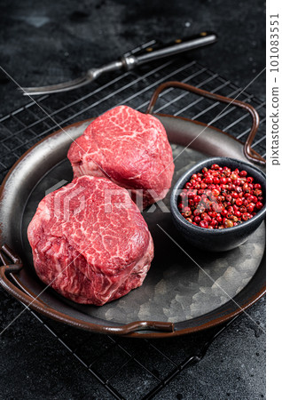 Dry aged Raw steaks fillet Mignon, Beef tenderloin. Black background. Top view 101083551