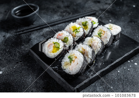 Korean rice roll Kimbap or gimbap, Korean sushi. Black background. Top view Korean rice roll Kimbap or gimbap, Korean sushi. Black background. Top view 101083678