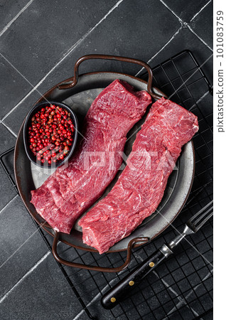 Raw lamb tenderloin Fillet, Mutton Sirloin Meat. Black background. Top view Raw lamb tenderloin Fillet, Mutton Sirloin Meat. Black background. Top view 101083759