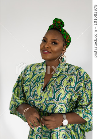 Beautiful african american girl wearing national turban headscarf over white wall background portrait - inclusion and diversity concept 101083979