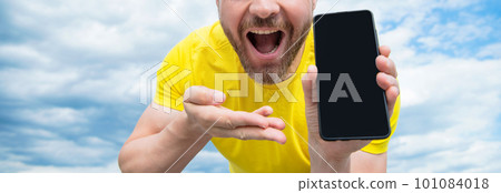 cropped view of man presenting smartphone screen with copy space cropped view of man presenting smartphone screen with copy space 101084018