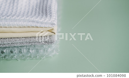 Recycling Fibers in the Textile Industry. Sustainable recycled cotton fiber. Many napkins fabrics made of recycled polyester synthetic fabric and bubble wrap Recycling Fibers in the Textile Industry. Sustainable recycled cotton fiber. Many napkins fabrics made of recycled polyester synthetic fabric and bubble wrap 101084098