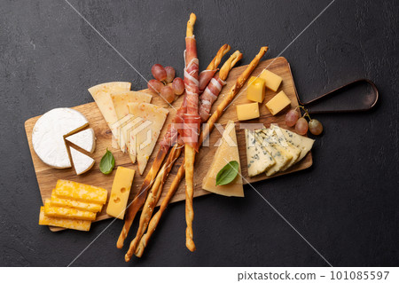 Antipasto board with various cheese and snacks 101085597