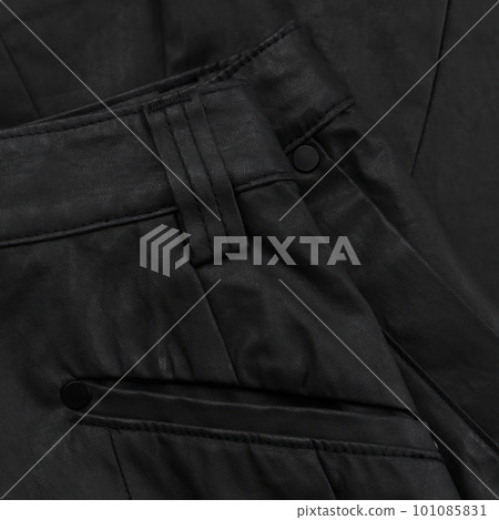 Detail of a black waxed trouser belt with loop and pocket 101085831