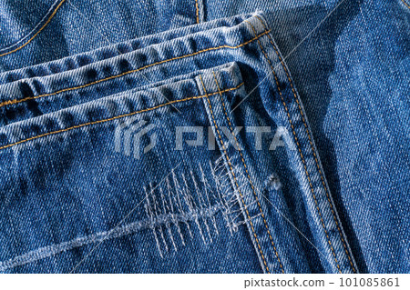 Details of blue jeans - hem with decorative seams close up Details of blue jeans - hem with decorative seams close up 101085861